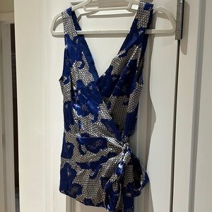 Diane von Furstenberg wrap silk top. 100% silk blue and champagne color print.